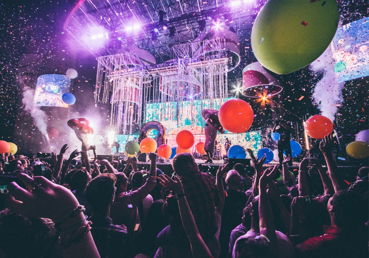 A busy venue dancefloor with party lights
